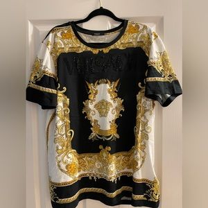 Versace black, gold, and white t-shirt with embellished Versace print.